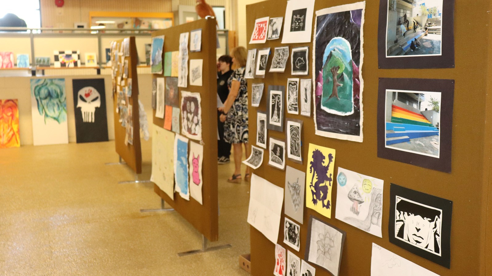 Robron principal Cathy Manson and students admire some of the work on display.
