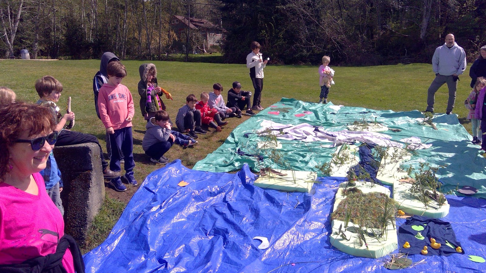 Students showcase their learning about wetlands to parents.
