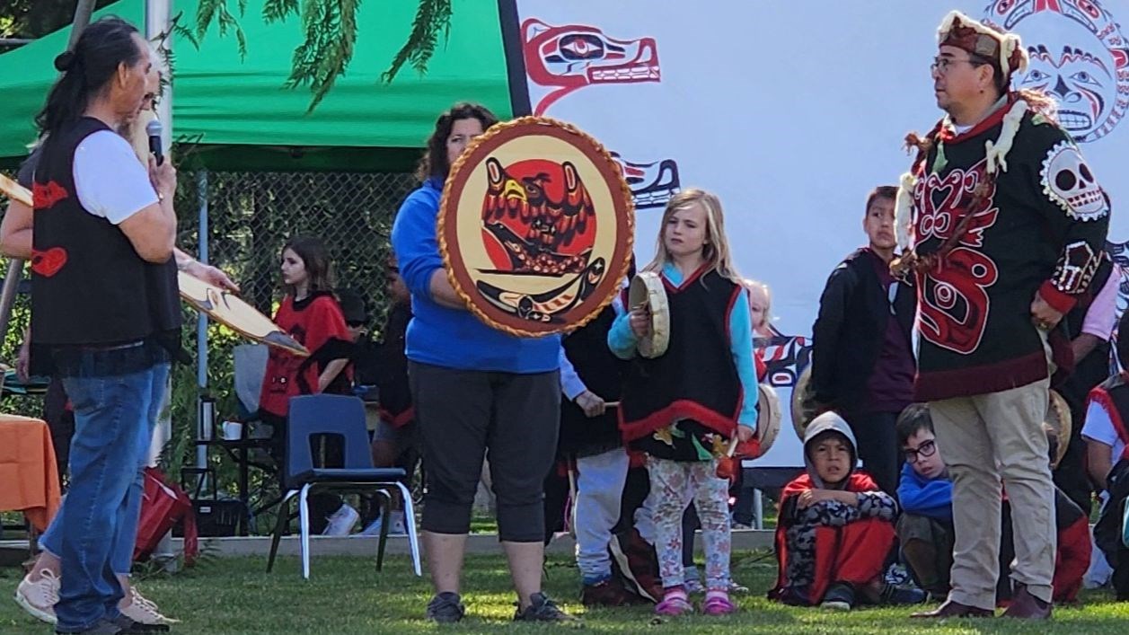 Qwaya Sam presenting Art to Thomas Henderson, Cedar Elementary Play Potlatch 2024